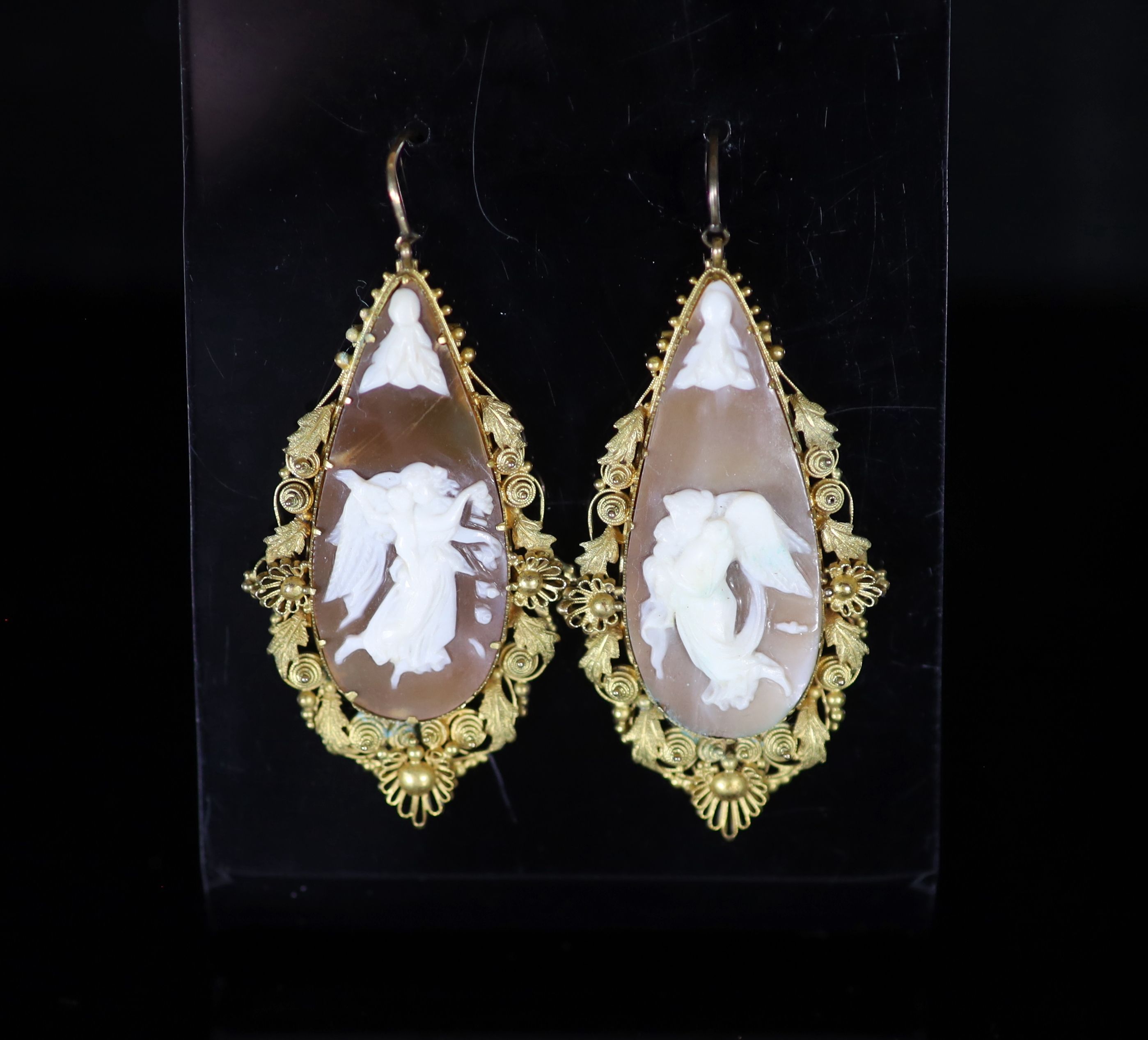 A pair of Victorian gold mounted cameo shell teardrop shaped drop earrings